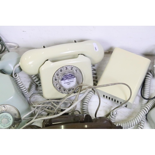 398 - Five late 20th Century plastic ring dial telephones in assorted colours. 1 box.