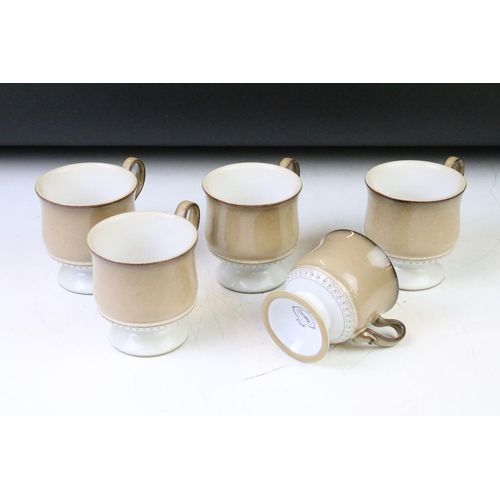 128A - Denby brown glazed tea & dinner service with moulded detail, to include mugs & saucers, tea plates, ... 