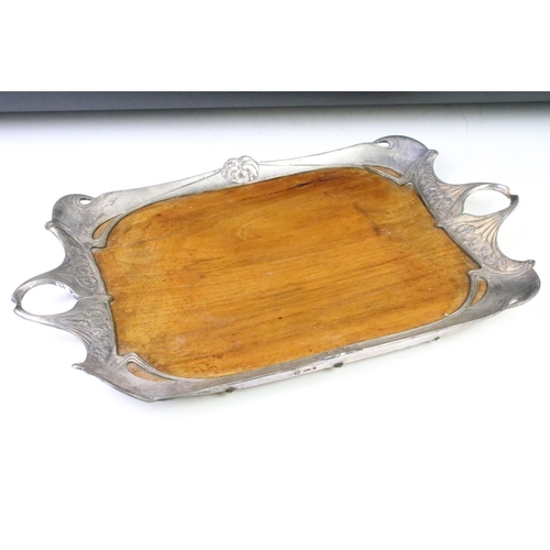 159 - Art Nouveau twin-handled tray, the white metal border of sinuous design with cast floral details, wi... 