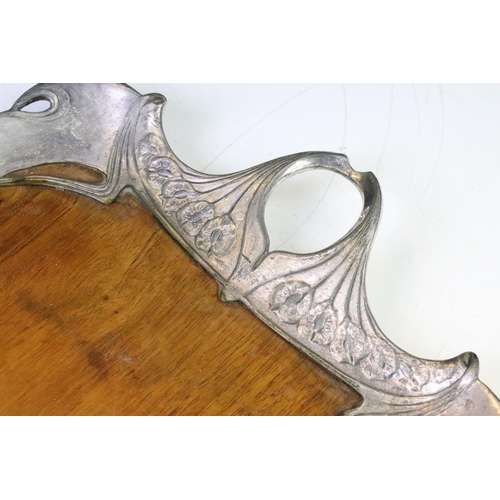 159 - Art Nouveau twin-handled tray, the white metal border of sinuous design with cast floral details, wi... 