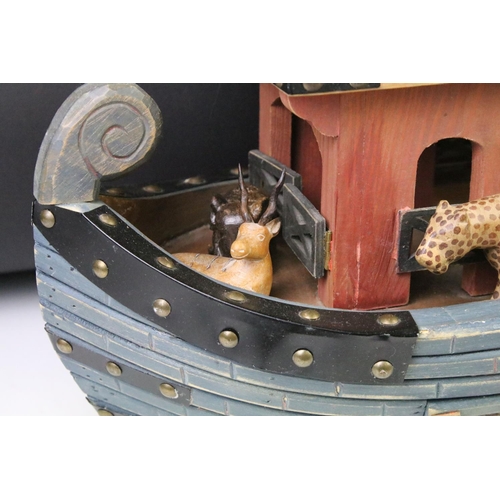 193 - Painted wooden Noah's Ark with carved animals, featuring giraffes, lion, elephants, zebras, etc. Mea... 