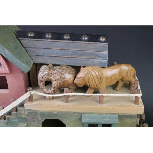 193 - Painted wooden Noah's Ark with carved animals, featuring giraffes, lion, elephants, zebras, etc. Mea... 