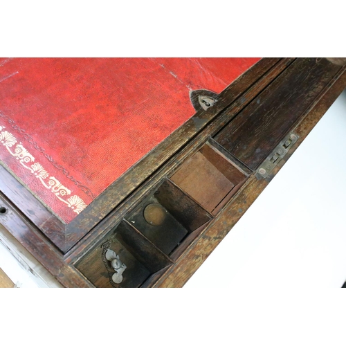 199 - Two Victorian wooden writing boxes, to include a campaign style rosewood example with brass fittings... 