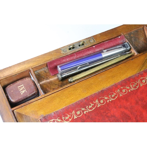 199 - Two Victorian wooden writing boxes, to include a campaign style rosewood example with brass fittings... 