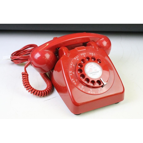 372 - Group of four late 20th Century ring dial plastic telephones in assorted colours.