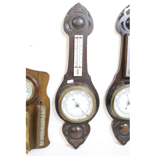 381 - Group of early 20th Century barometers to include three oak cased banjo aneroid barometers, and two ... 