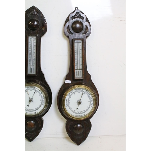 381 - Group of early 20th Century barometers to include three oak cased banjo aneroid barometers, and two ... 