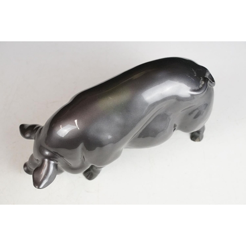 140 - Resin figure of a pig, with metallic pewter effect finish, approx 24cm long