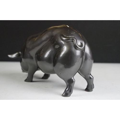 140 - Resin figure of a pig, with metallic pewter effect finish, approx 24cm long