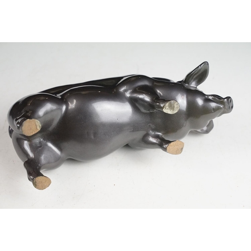 140 - Resin figure of a pig, with metallic pewter effect finish, approx 24cm long