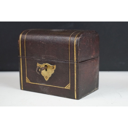 142 - Late 19th / early 20th century scent bottle travelling set, the leather bound case with rounded lid ... 