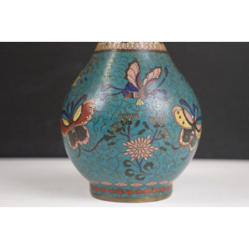 144 - 18th / 19th Century Chinese Cloisonne blue ground bottle vase decorated with butterflies and a flora... 