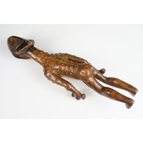 145 - Carved African hardwood figure of a stylised female holding a bottle & vessel (approx 42cm tall), to... 