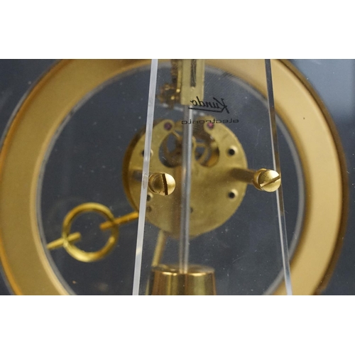 174 - Mid 20th C Kundo electronic skeleton mantel clock, the brass case with four bevelled glass panels, p... 