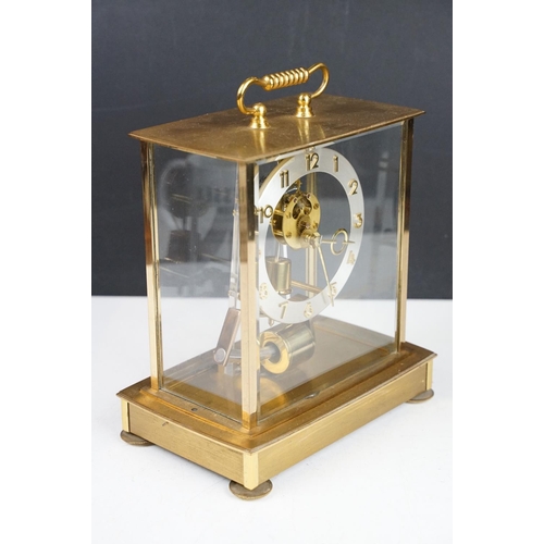 174 - Mid 20th C Kundo electronic skeleton mantel clock, the brass case with four bevelled glass panels, p... 