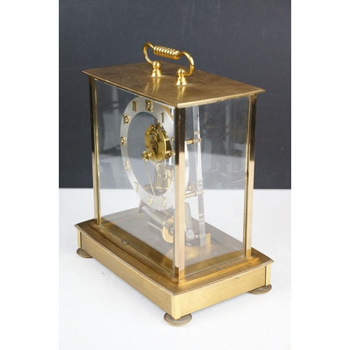 174 - Mid 20th C Kundo electronic skeleton mantel clock, the brass case with four bevelled glass panels, p... 