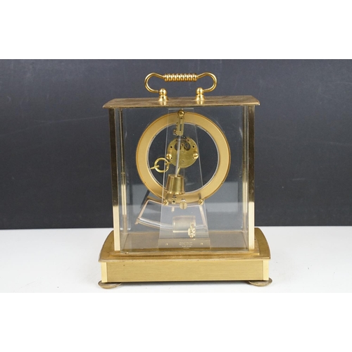 174 - Mid 20th C Kundo electronic skeleton mantel clock, the brass case with four bevelled glass panels, p... 