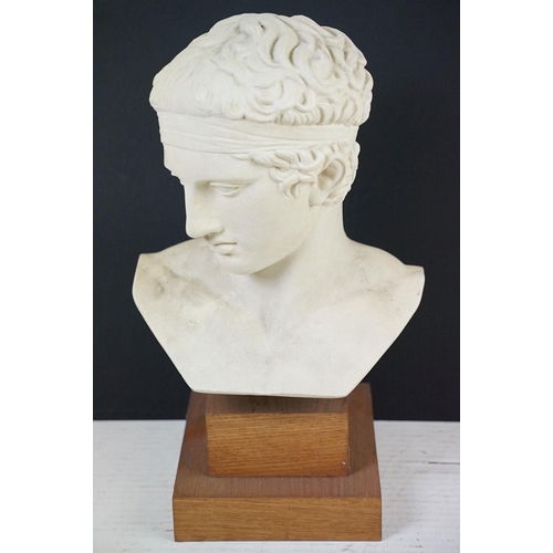 191 - Diadumenos large bust, depicting an Ancient Greek athlete, raised on a two-stepped wooden base, meas... 