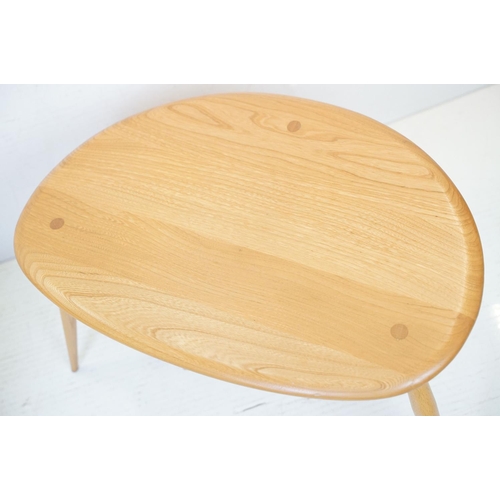 607 - Ercol Pale Elm and Beech Nest of Three Pebble Tables, model 354, 65cm long x 41cm high