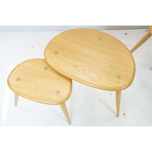 607 - Ercol Pale Elm and Beech Nest of Three Pebble Tables, model 354, 65cm long x 41cm high