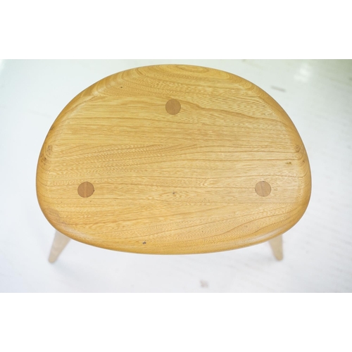 607 - Ercol Pale Elm and Beech Nest of Three Pebble Tables, model 354, 65cm long x 41cm high