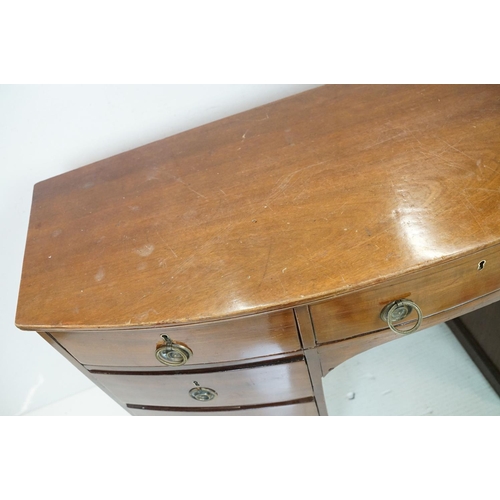 616 - 19th century Bow Front Mahogany Kneehole Desk or Dressing Chest with an arrangement of nine drawers ... 