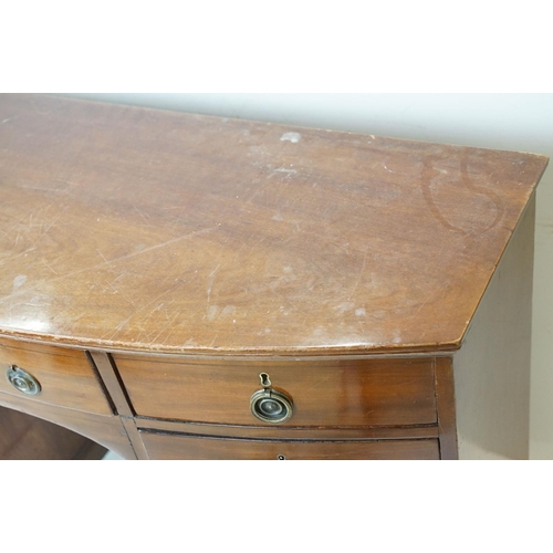 616 - 19th century Bow Front Mahogany Kneehole Desk or Dressing Chest with an arrangement of nine drawers ... 