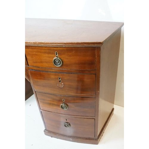 616 - 19th century Bow Front Mahogany Kneehole Desk or Dressing Chest with an arrangement of nine drawers ... 