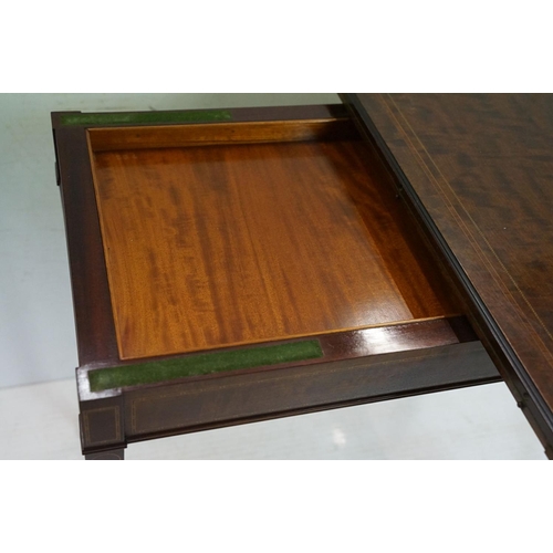 633 - Edwardian Mahogany Inlaid Rectangular Card Table, the fold-over top opening to a green baise playing... 