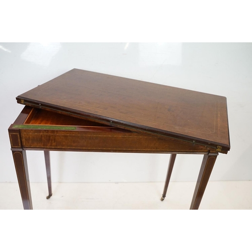 633 - Edwardian Mahogany Inlaid Rectangular Card Table, the fold-over top opening to a green baise playing... 