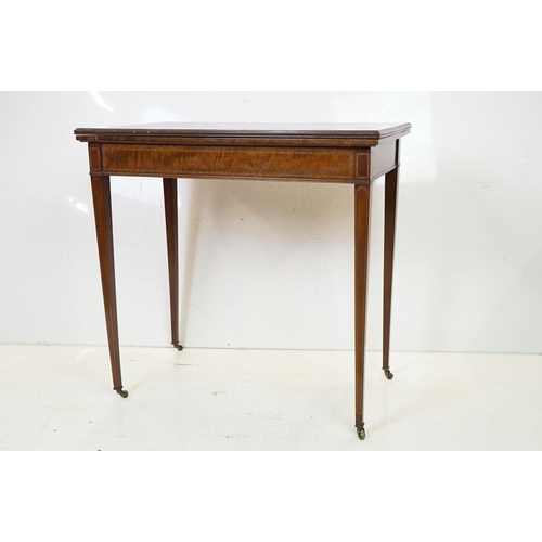 633 - Edwardian Mahogany Inlaid Rectangular Card Table, the fold-over top opening to a green baise playing... 