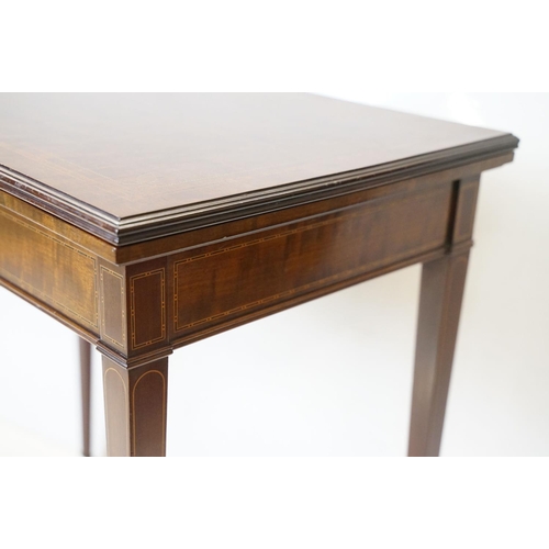 633 - Edwardian Mahogany Inlaid Rectangular Card Table, the fold-over top opening to a green baise playing... 