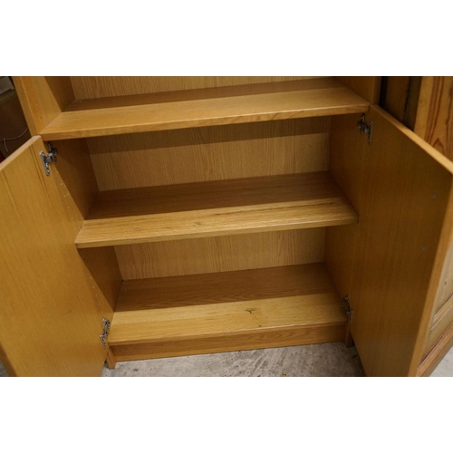 638 - Pair of Danish Dansk Pale Oak Bookcase Cupboards, each with three adjustable shelves over two cupboa... 