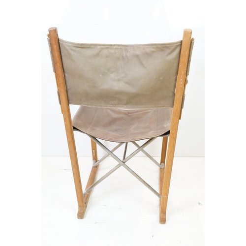 639 - Mid century style Folding Chair with brown leather back and seat designed by Peter Karpf for Tripp T... 