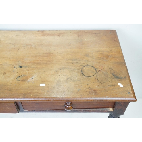 646 - Victorian Mahogany Side Table with two drawers and raised on turned legs, 74cm high x 106cm wide x 5... 