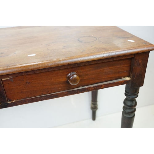 646 - Victorian Mahogany Side Table with two drawers and raised on turned legs, 74cm high x 106cm wide x 5... 