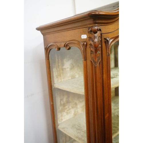 670 - French style Carved Walnut Display Cabinet, the single glazed door opening to a grey velvet lined in... 