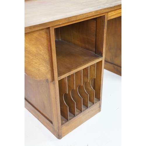 677 - Mid century Teak Long Desk with pedestal of four drawers and a pedestal with stationery compartments... 