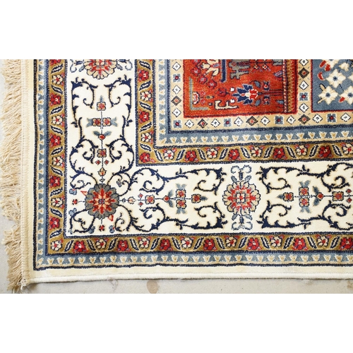 679 - Ivory ground Kashmir Carpet, Persian panel design, 300cm x 200cm