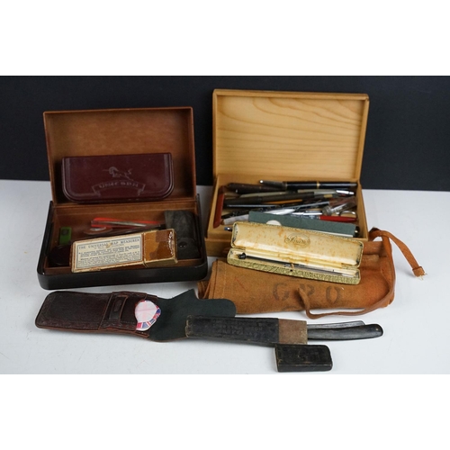 325 - A box of mixed collectables to include a collection of ballpoint and fountain pens, cut throat razor... 