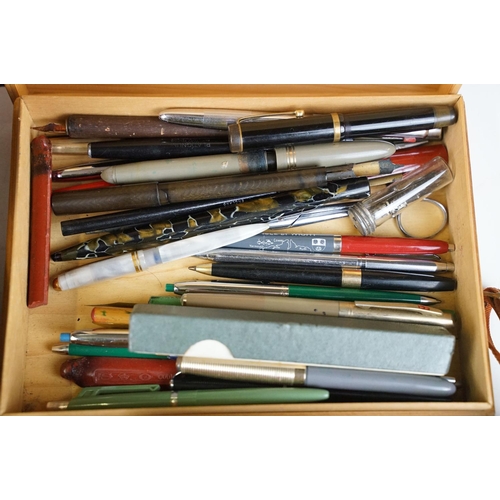 325 - A box of mixed collectables to include a collection of ballpoint and fountain pens, cut throat razor... 