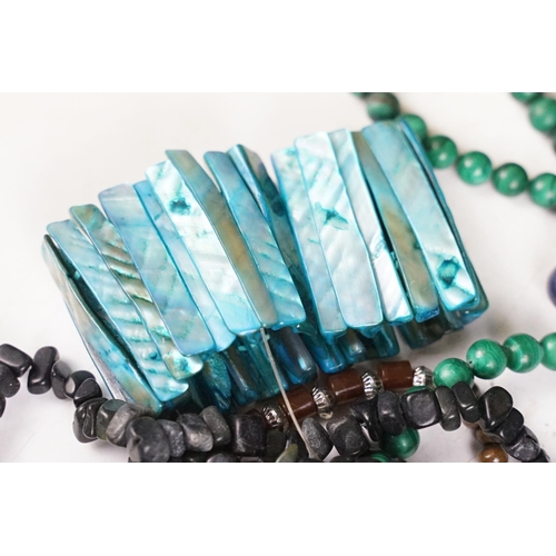 339 - A small group of contemporary costume jewellery to include a malachite beaded necklace.