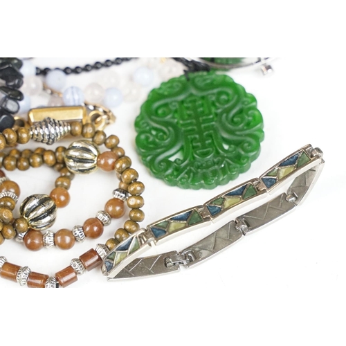 339 - A small group of contemporary costume jewellery to include a malachite beaded necklace.