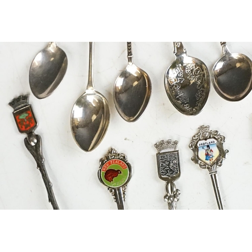 364 - A collection of sterling silver and silver plated souvenir teaspoons.