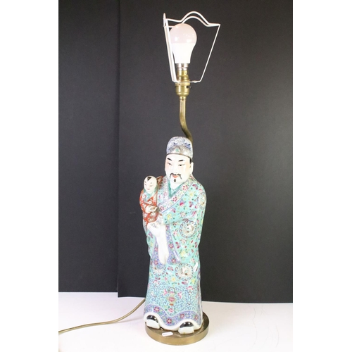 123 - Chinese porcelain lamp base in the form of a man with baby each wearing coloured enamelled robes, ra... 