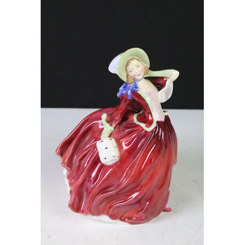 125 - Four Royal Doulton porcelain figurines to include The Old Balloon Seller (HN1315), Autumn Breeze (HN... 