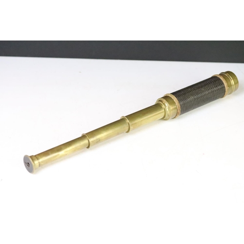 176 - An early 20th century brass three drawer telescope by J.W. Steward of London.