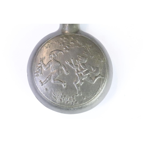 208 - A vintage pewter scent bottle with decorative front and rear panels with pixie and floral scene.