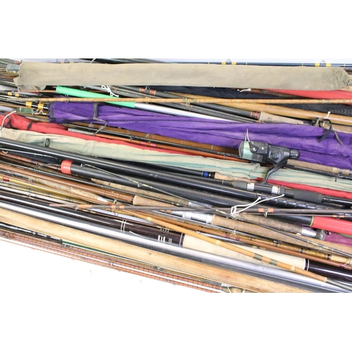 417 - A vary large collection of vintage and contemporary fishing rods to include split cane examples.