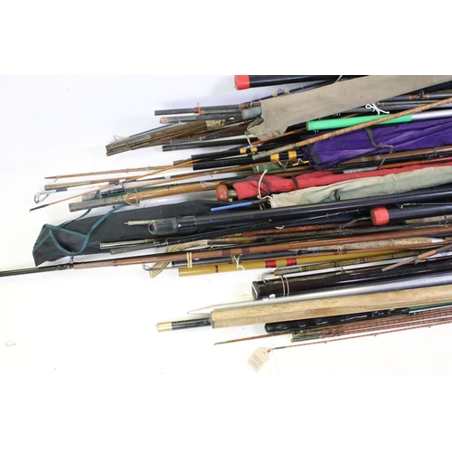 417 - A vary large collection of vintage and contemporary fishing rods to include split cane examples.